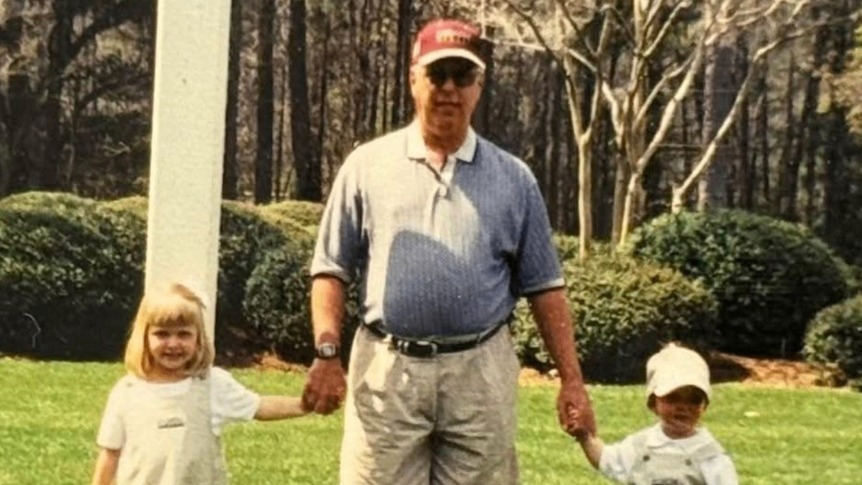 Harry Kenneth Fritz on the grass with his two grandchildren — the foundation of Parlay.